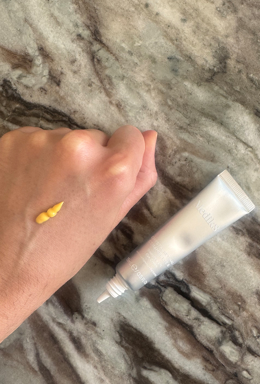 A picture of beauty editor Eleanor swatching the Medik8 eye cream on her hand
