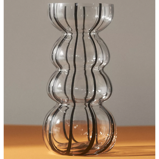 clear glass wavy vase with black striped pattern