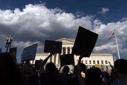 Abortion-rights activists protest outside the Supreme Court