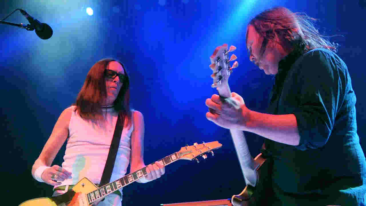 Urge Overkill performing onstage in 2013