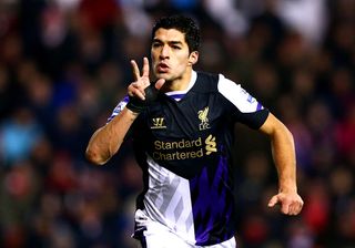 Luis Suarez of Liverpool celebrates as he scores their second goal during the Barclays Premier League match between Stoke City and Liverpool at Britannia Stadium on January 12, 2014 in Stoke on Trent, England.