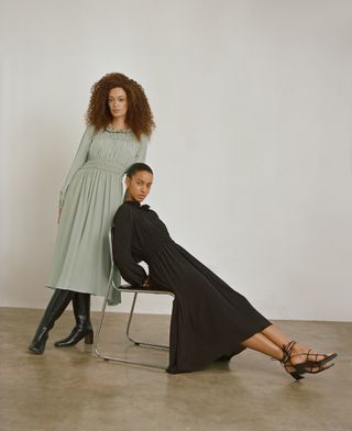 two women wearing dresses in mint and black from Dal the Label