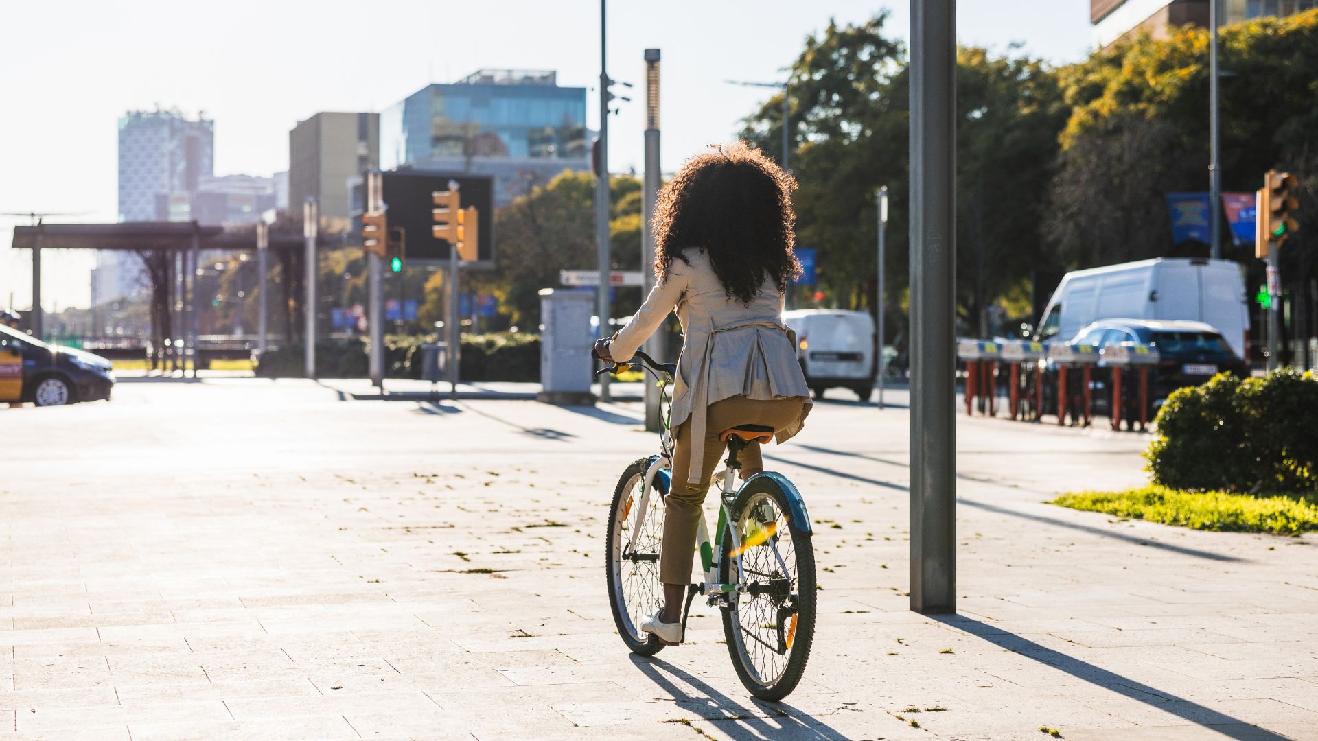 Woman riding bike on pavement