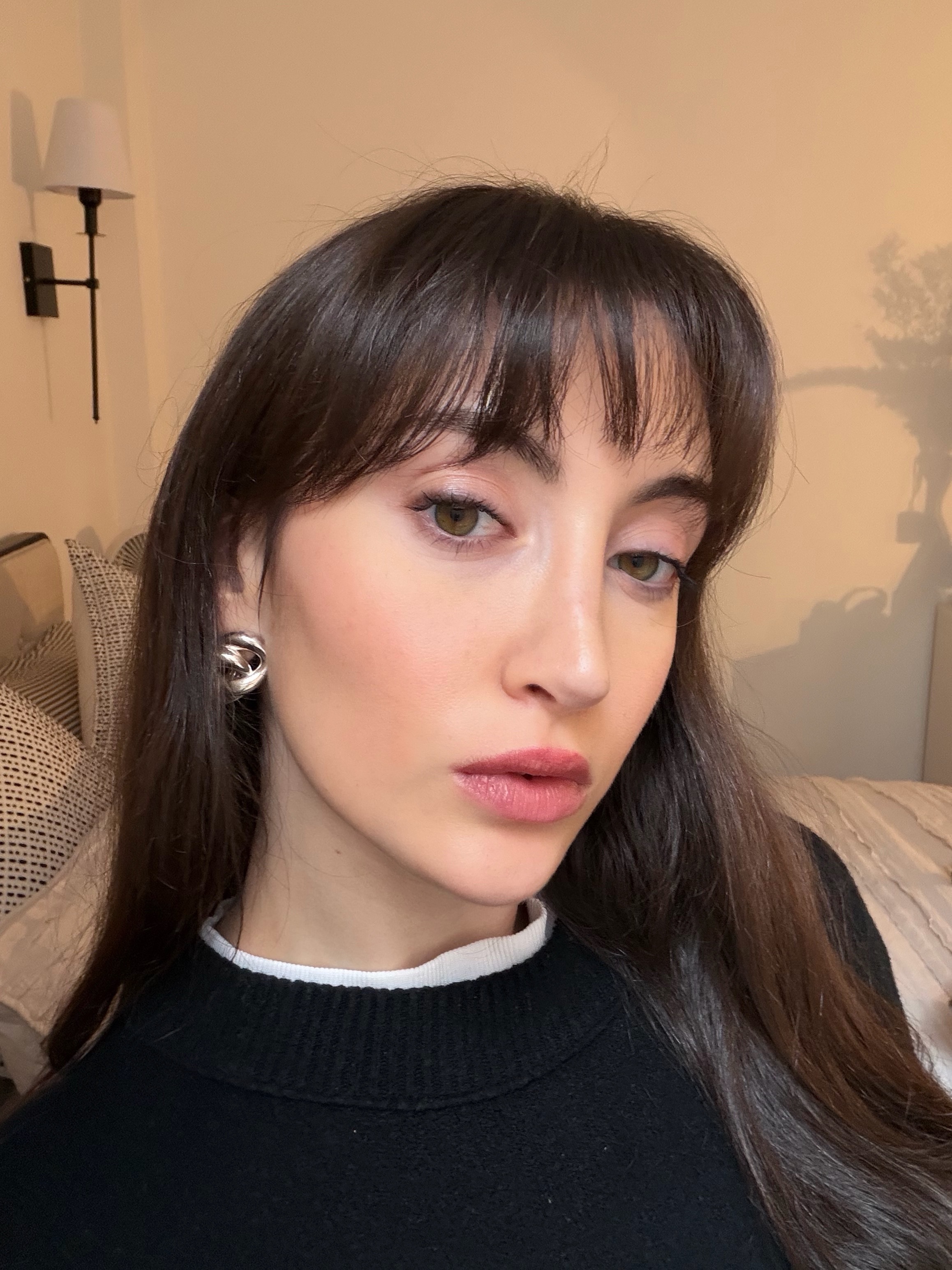 Brascia wearing a full face of Merit skincare and makeup.