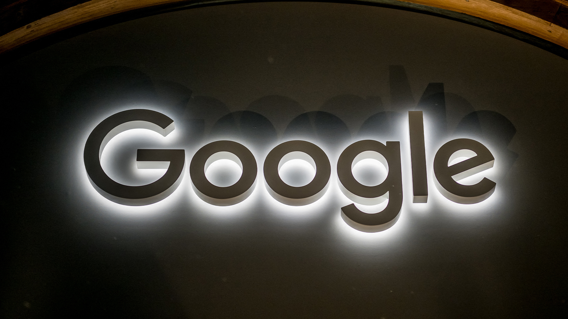Google sign illuminated against a wall at night during the World Economic Forum (WEF) meeting in Davos, Switzerland.