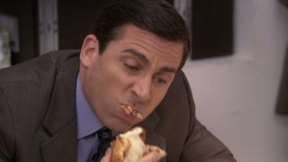 Michael eating a mouthful of meatball parm sandwich in The Office