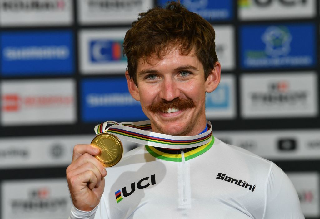 Gold medallist Ashton Lambie of the US wears his rainbow jersey as world champion as he celebrates on the podium after victory in the mens Individual Pursuit final during the UCI Track Cycling World Championships at The JeanStablinski Velodrome in Roubaix northern France on October 22 2021 Photo by Denis Charlet AFP Photo by DENIS CHARLETAFP via Getty Images