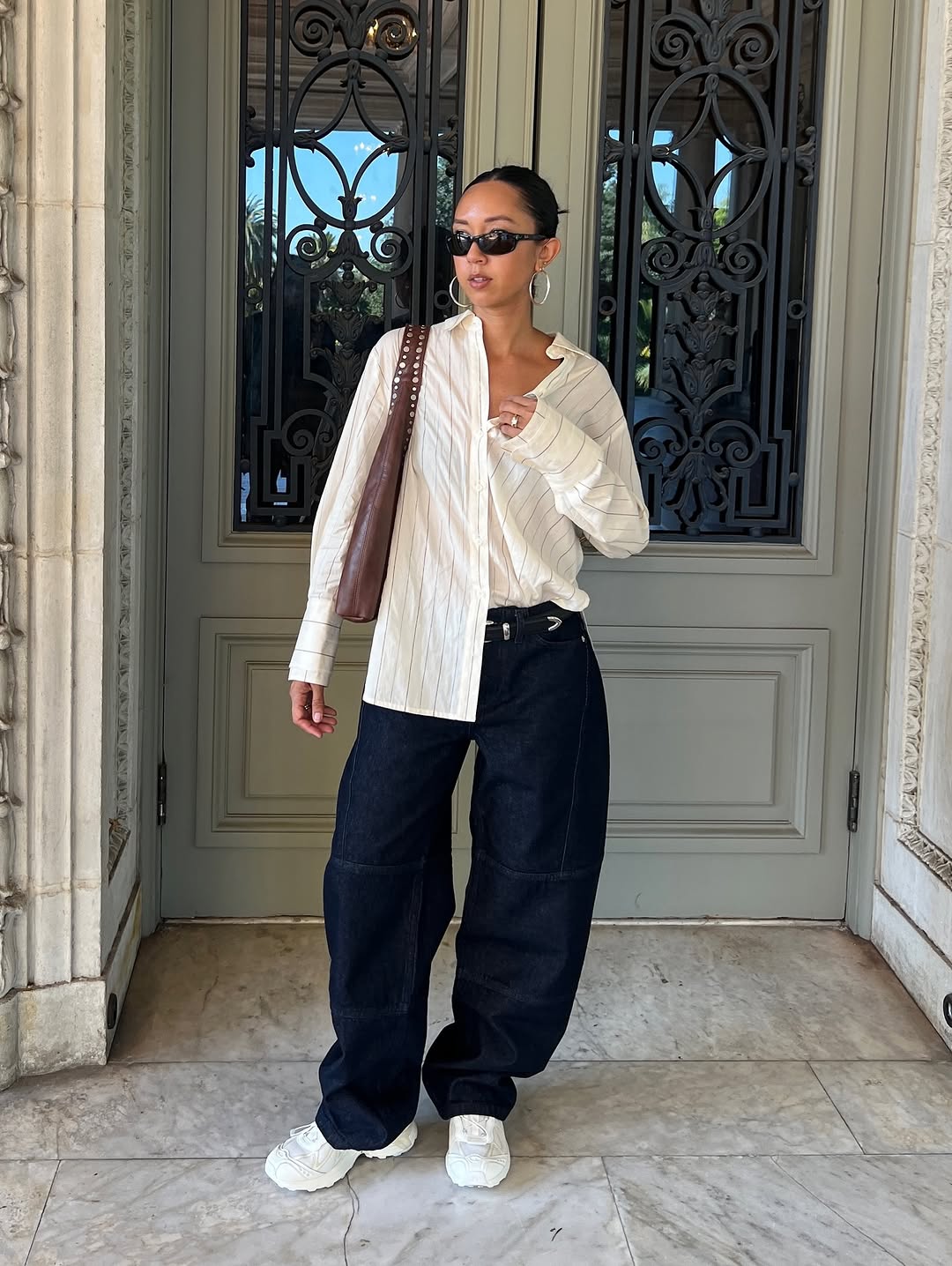 woman wearing winter sneaker outfit 2025