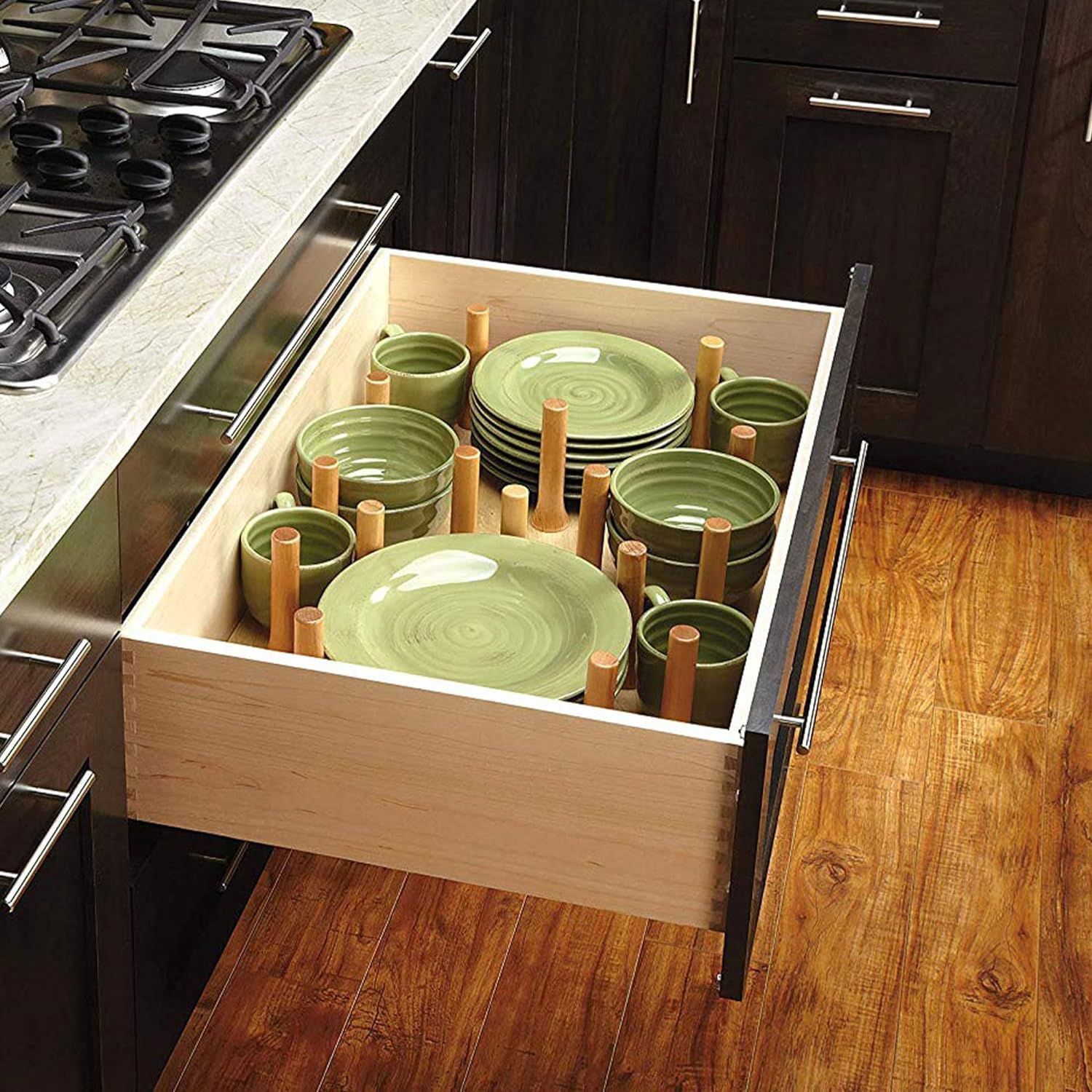 a kitchen drawer with pegboard organizer
