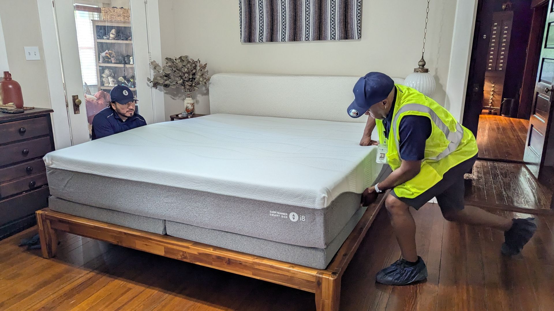 The image shows the Sleep Number i8 mattress during delivery and set up