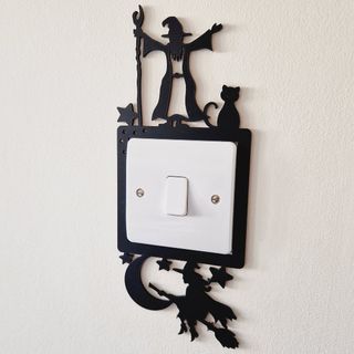 Witch and wizard light switch surround