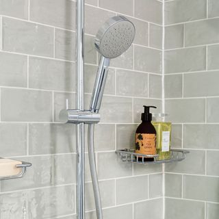 bathroom with grey tiled walls and shower
