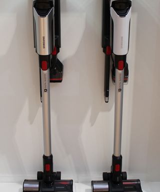 white & silver vacuum cleaner with flexible handle