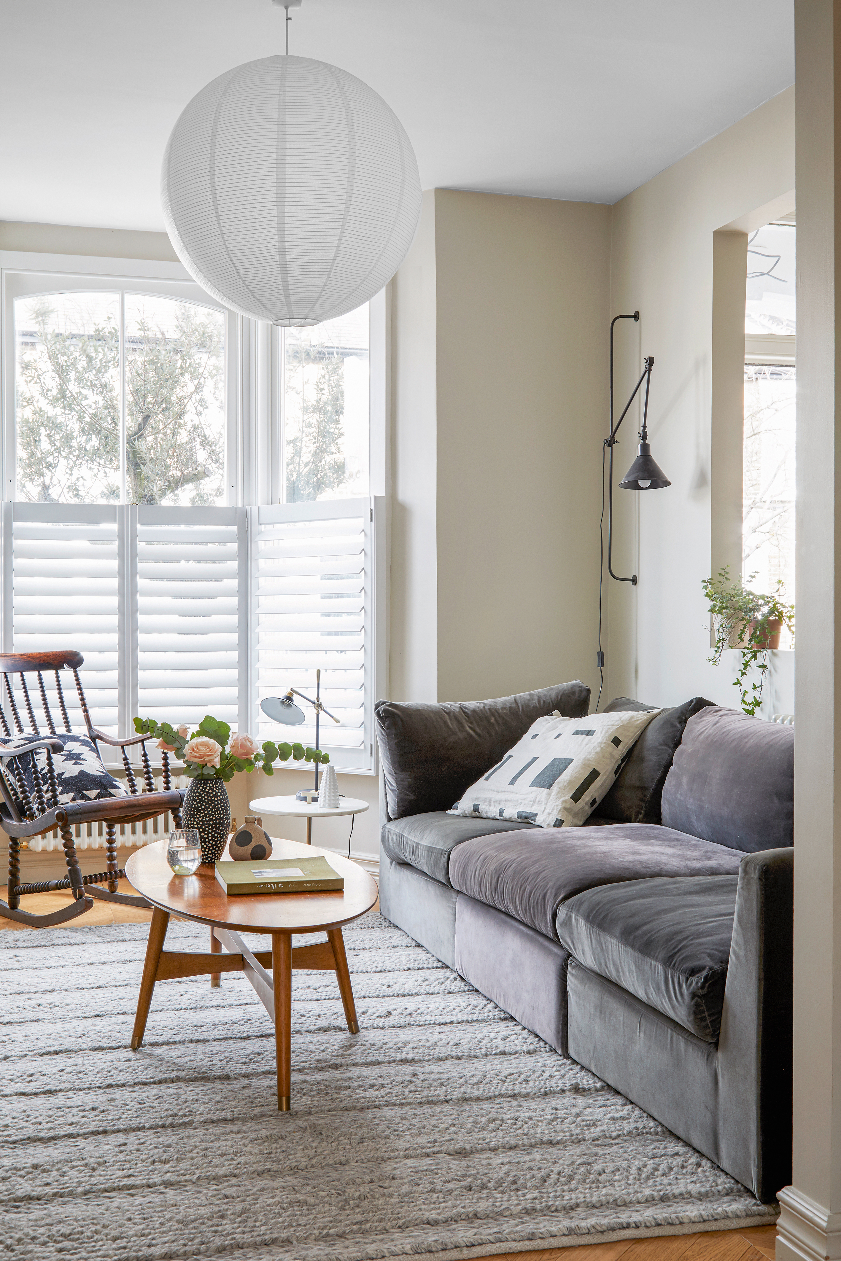 Small grey living room with over sized light