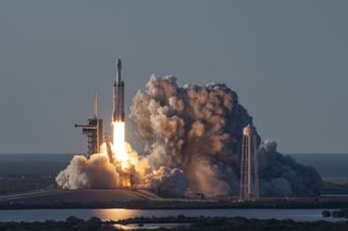 SpaceX's Falcon Heavy rocket lifts off carrying the Arabsat-6A communications satellite on April 11, 2019.