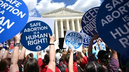 Abortion rights protesters in front of Supreme Court in June 2024