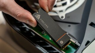 A Seagate Firecuda 530 being inserted into a PS5