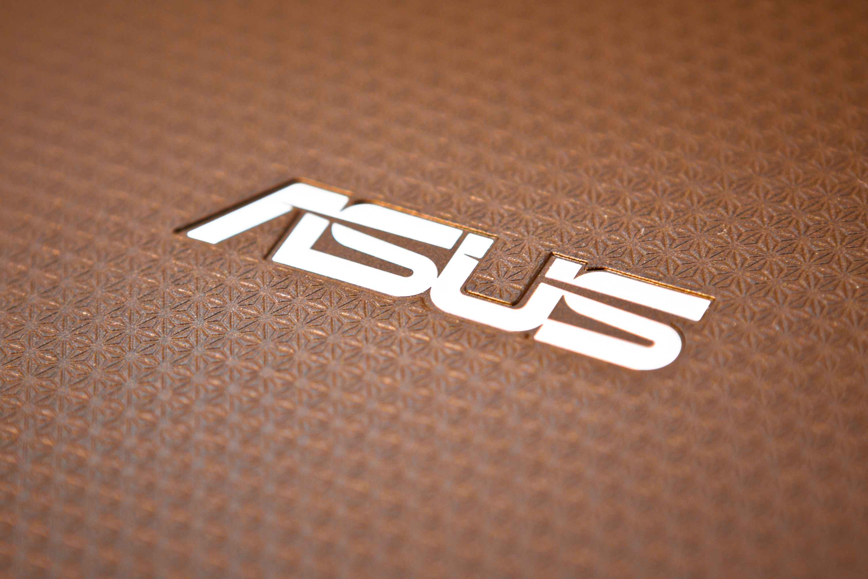 An Asus logo on a laptop. 