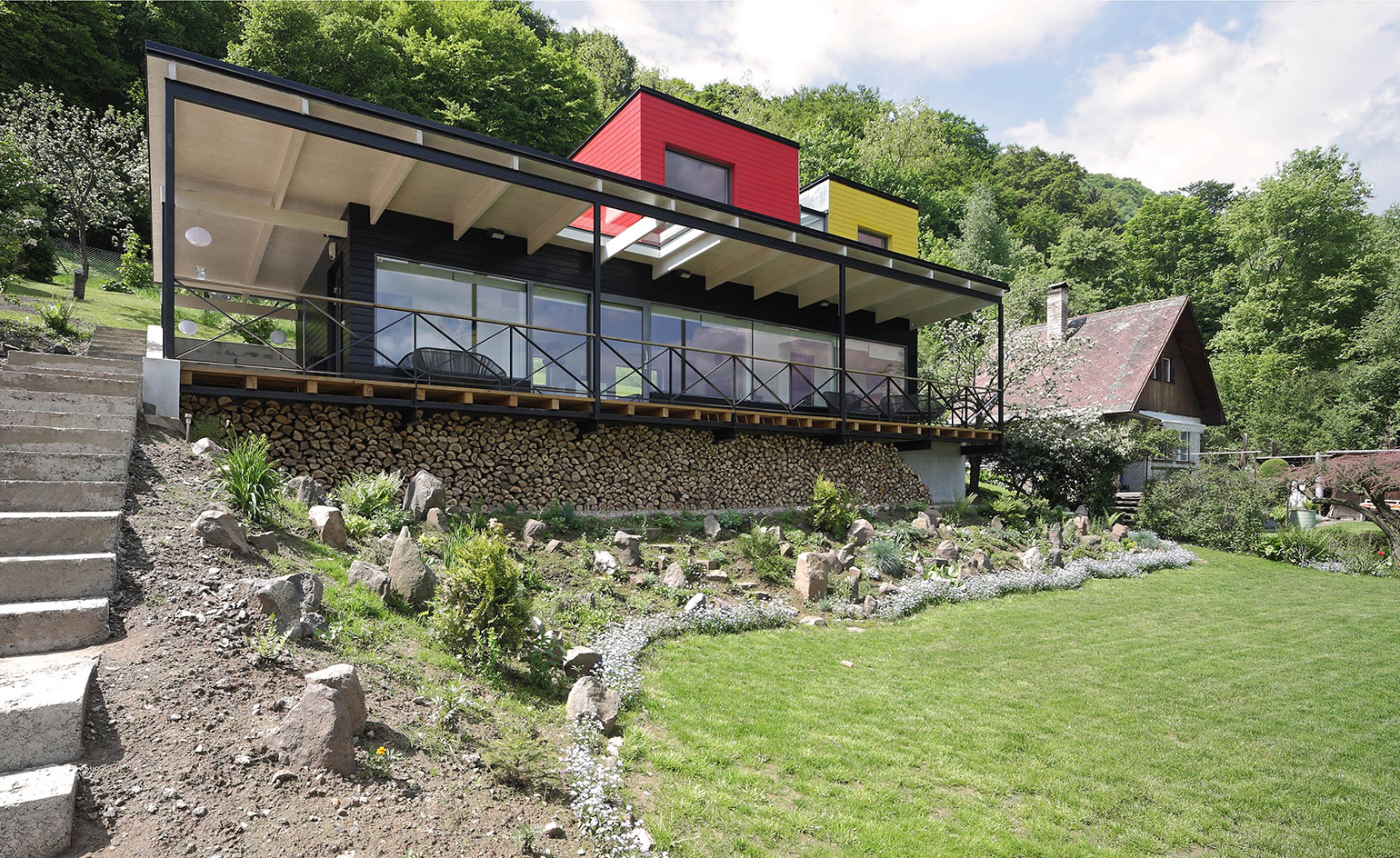 Traditional cottage with black lines and coloured blocks