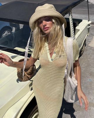 Elsa Hosk in crochet dress and hat with eyes closed