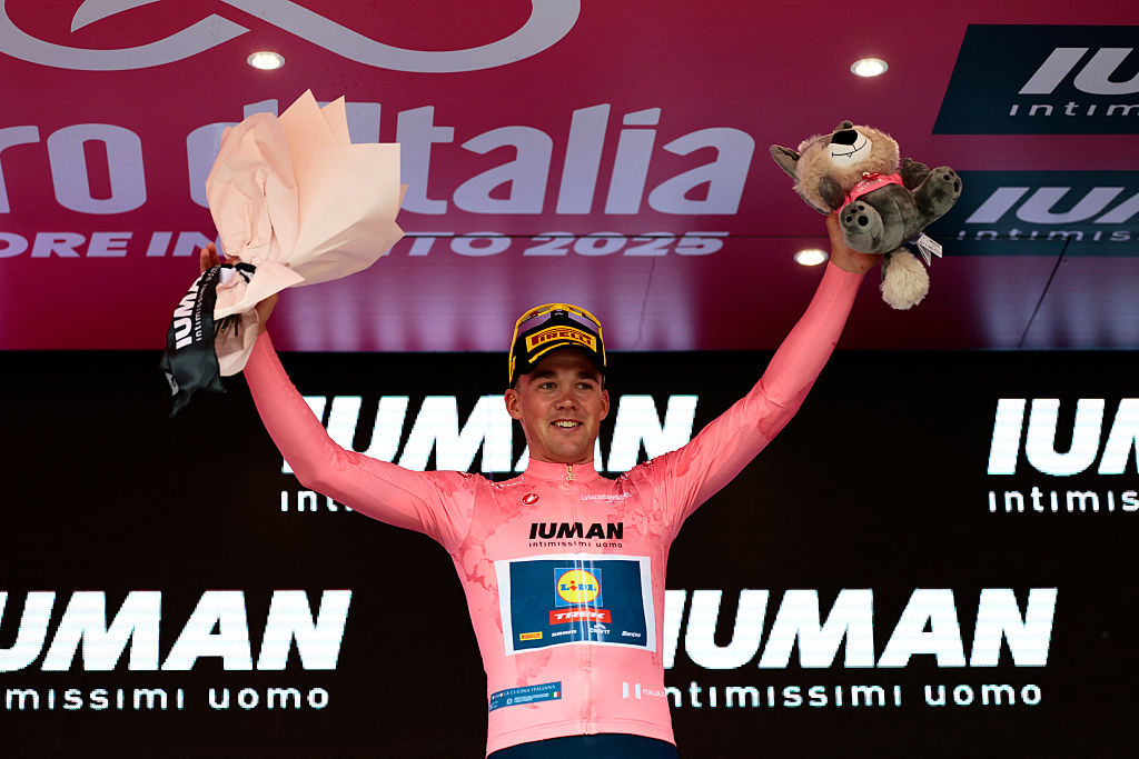 Lidl-Trek's Danish rider Mads Pedersen wears the overall leader pink jersey (Maglia Rosa) as he celebrates on the podium after winning the first stage of the 108th Giro d'Italia cycling race, 160km from Durres to Tirana in Albania, on May 9, 2025. (Photo by Luca Bettini / AFP)