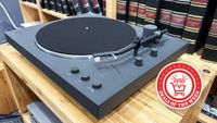 Sony's PS-LX3BT Bluetooth turntable on a hi-fi rack with a deals of the week roundel attached