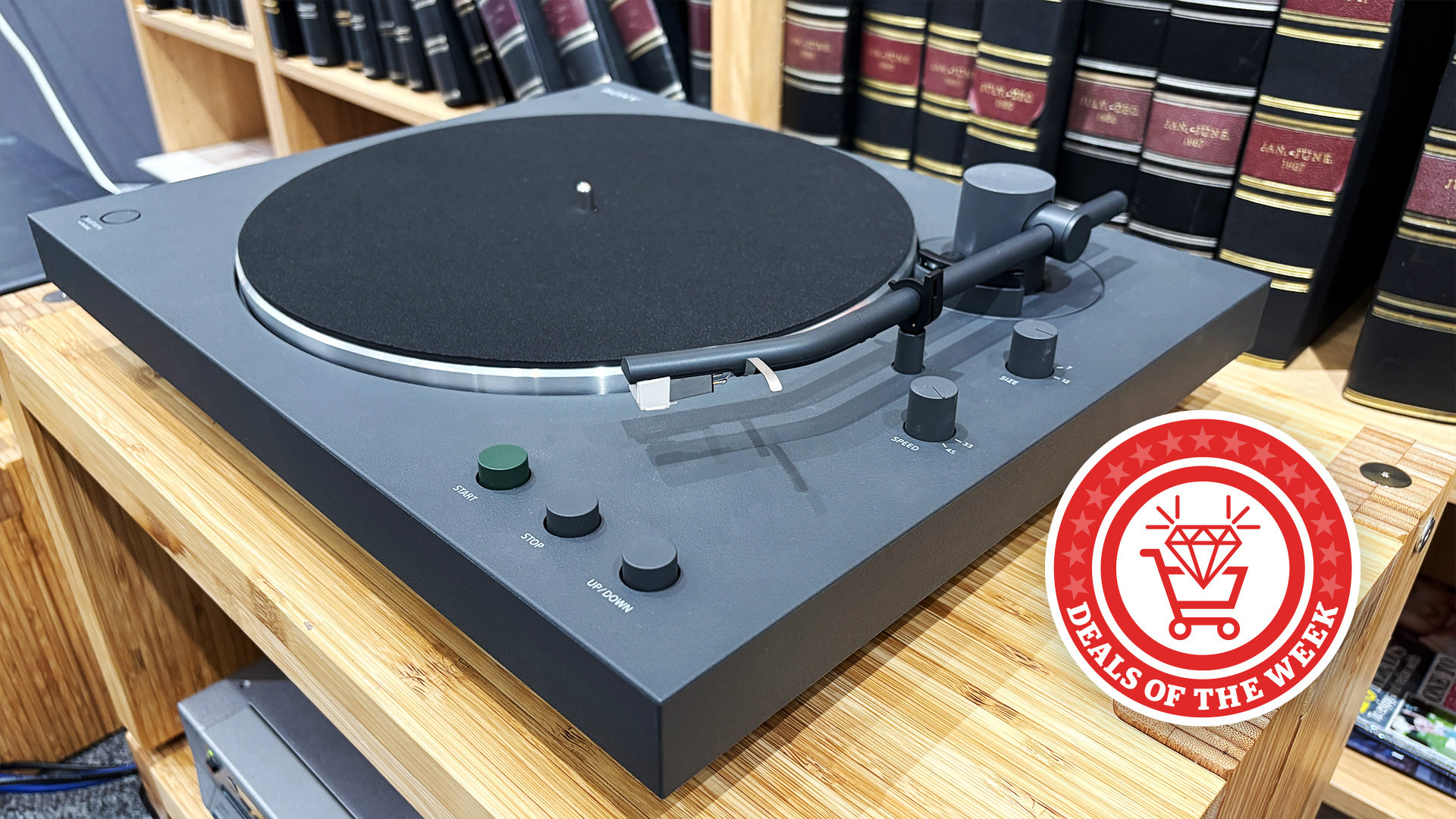 Sony's PS-LX3BT Bluetooth turntable on a hi-fi rack with a deals of the week roundel attached