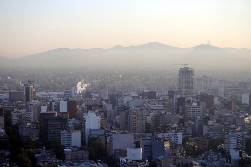 Hazy skyline of Mexico City at dawn. 