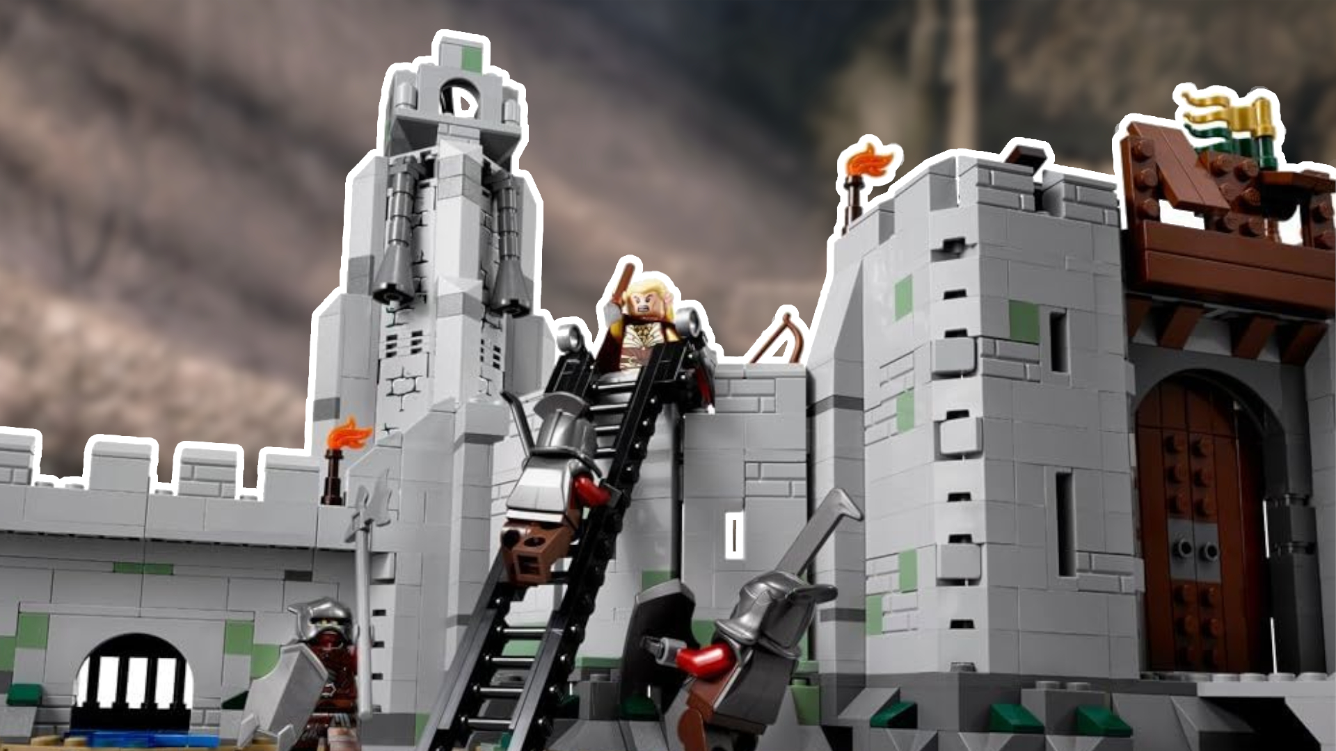 Lego Helm's Deep with minifigures fighting on the battlements, with a blurred shot of the valley behind