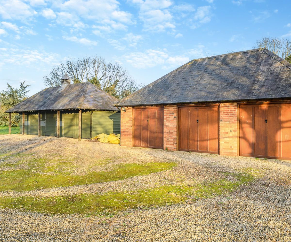 Two garages/outbuildings and a tack room