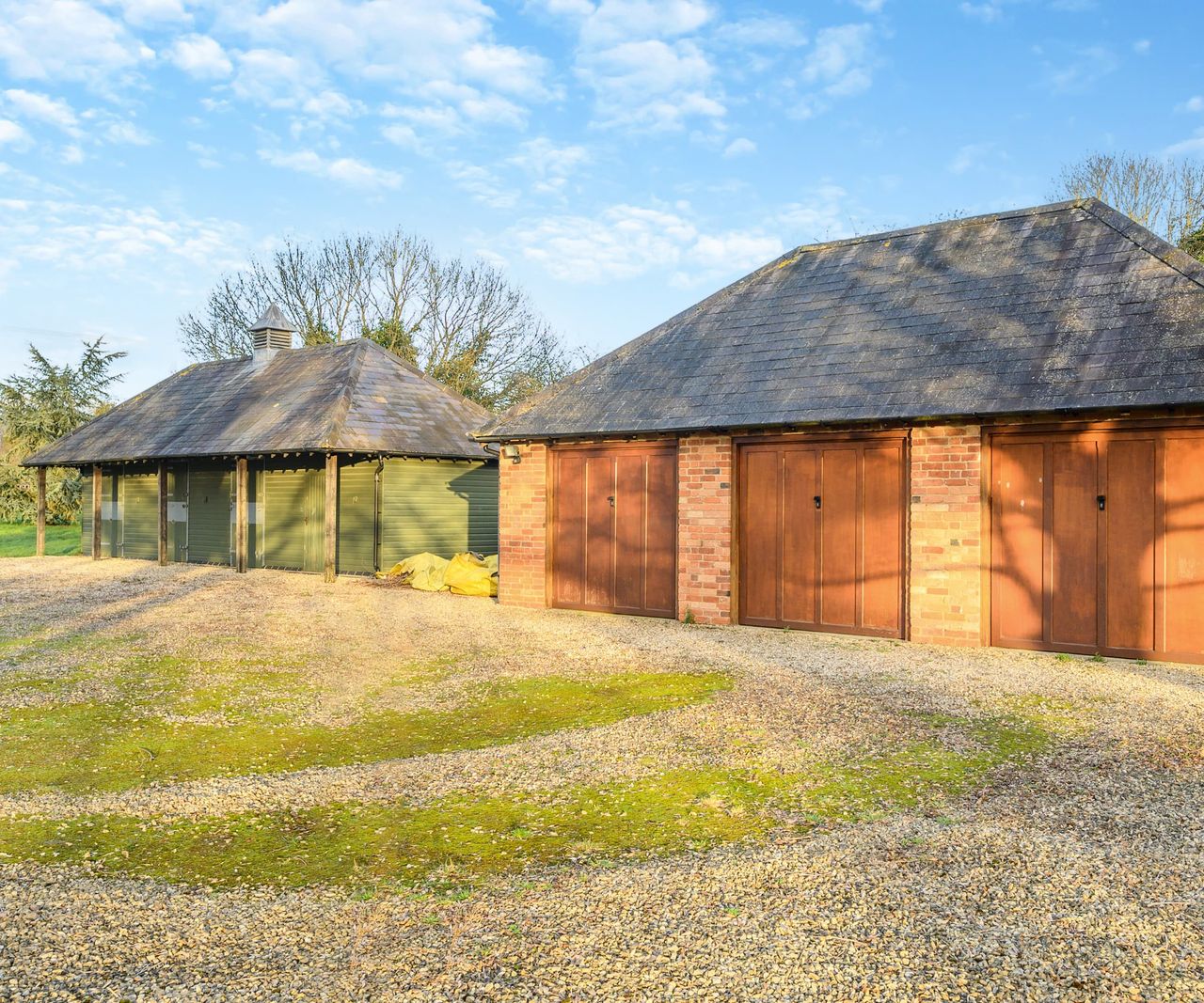 Two garages/outbuildings and a tack room