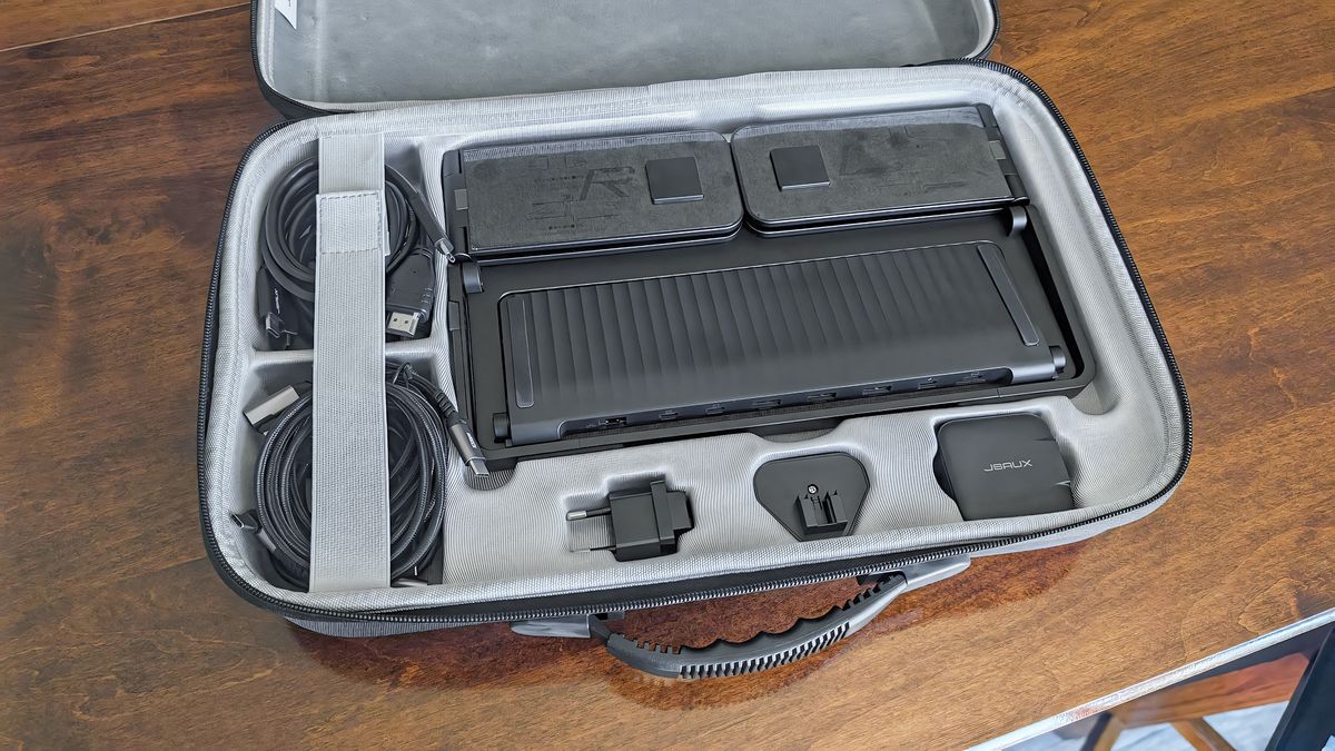 The JSAUX FlipGo Horizon Pro carrying case open with slots for USB-C cables, universal adapters, and the stand.