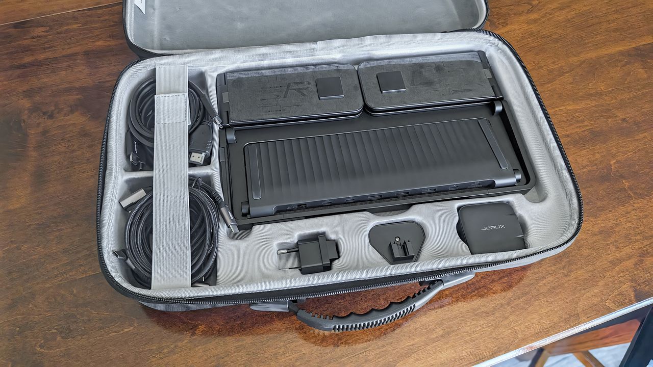 The JSAUX FlipGo Horizon Pro carrying case open with slots for USB-C cables, universal adapters, and the stand.