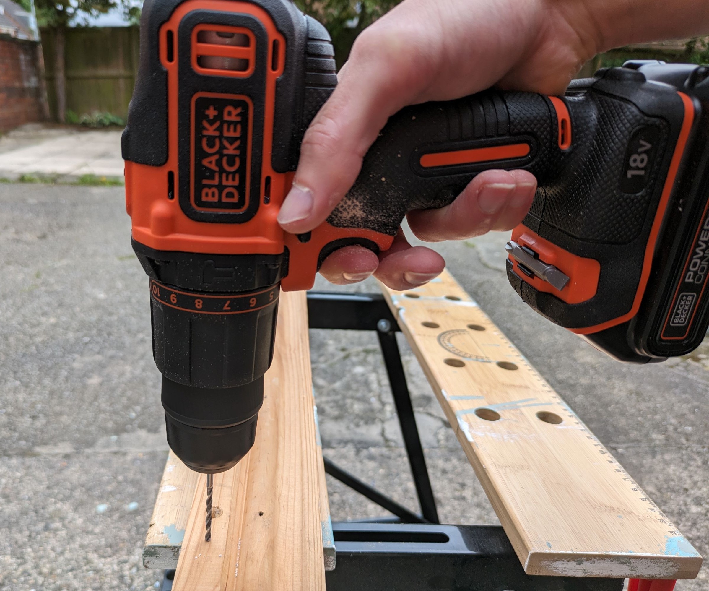 Black & Decker combi drill drilling into wood