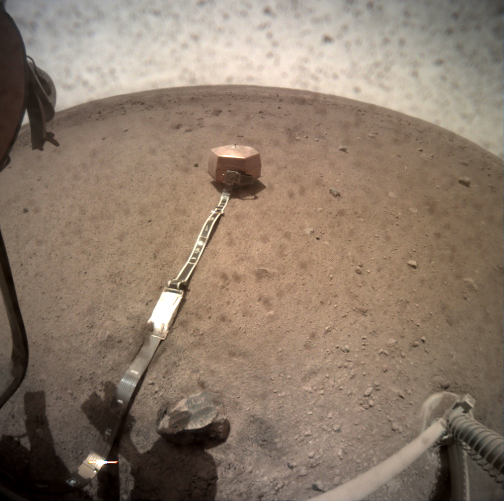 This image from NASA&#039;s InSight Mars lander, taken on Jan. 7, 2019, shows the SEIS seismograph instrument deployed on the Martian surface to measure Marsquakes.