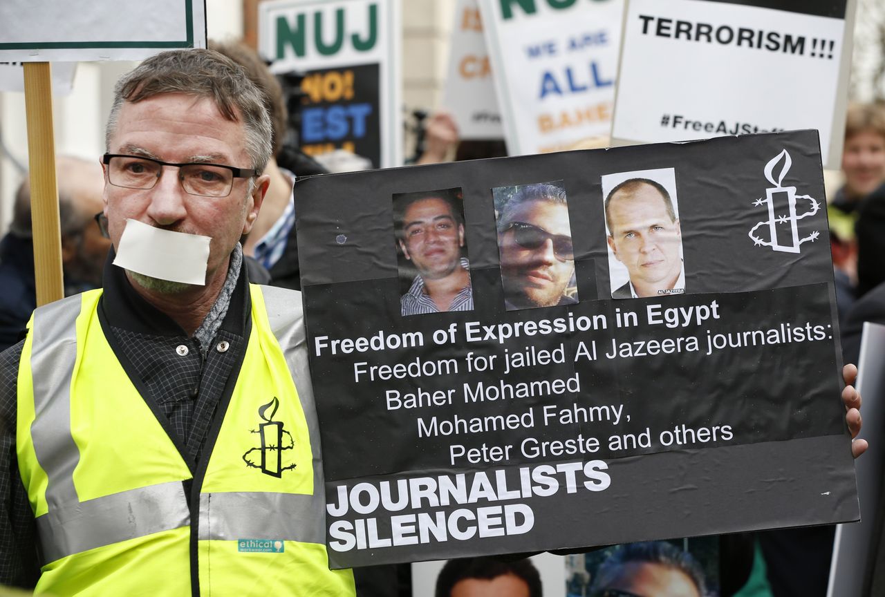 A demonstrator calls for journalists&amp;#039; release 