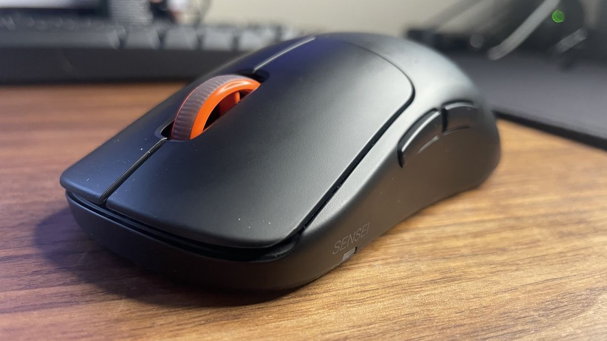 A SteelSeries Sensei Pro gaming mouse.
