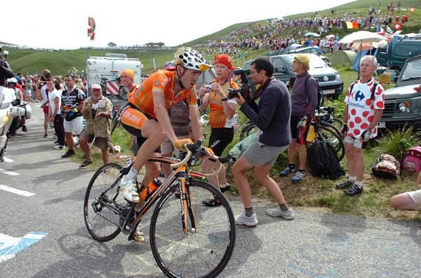 Olympic road champion Sammy Sanchez (Euskaltel - Euskadi) pursues Schleck and Contador.