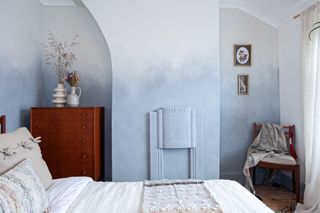 bedroom with blue ombre wall