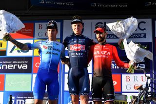 2022 winner Tim Merlier (Alpecin-Fenix) stands on top step of podium between second-placed Dylan Groenewegen (left) and Nacer Bouhanni (right)