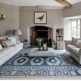 living room with sofa cushions and chelak wool rug