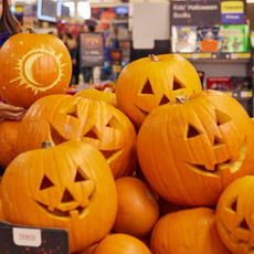 Tesco pre-carved pumpkins in a pile.