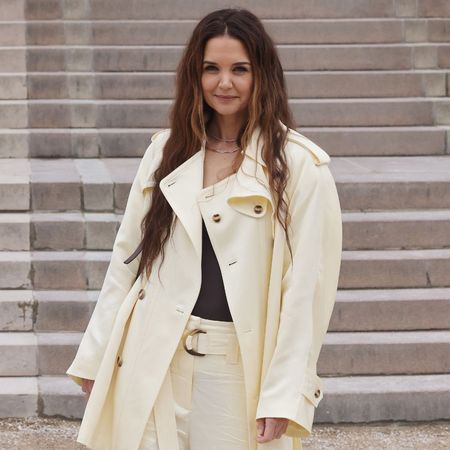 Katie Holmes wears a butter yellow blouse.