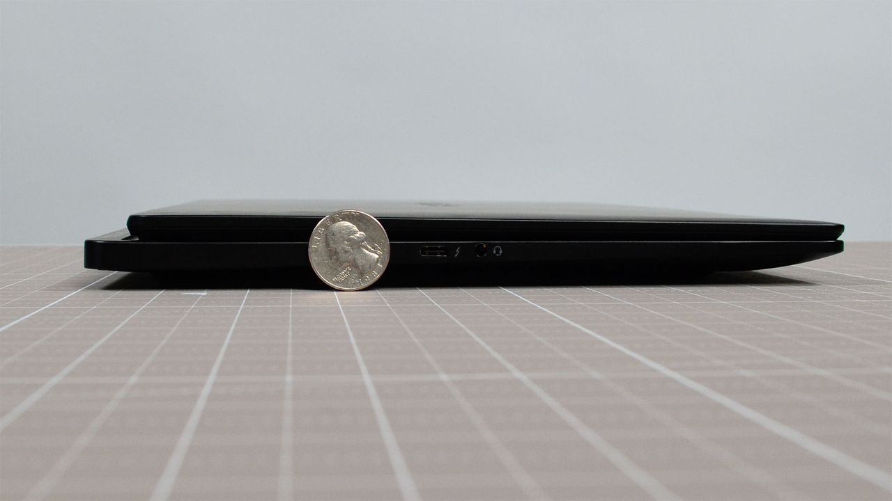 A quarter next to the HP Omen Transcend 14