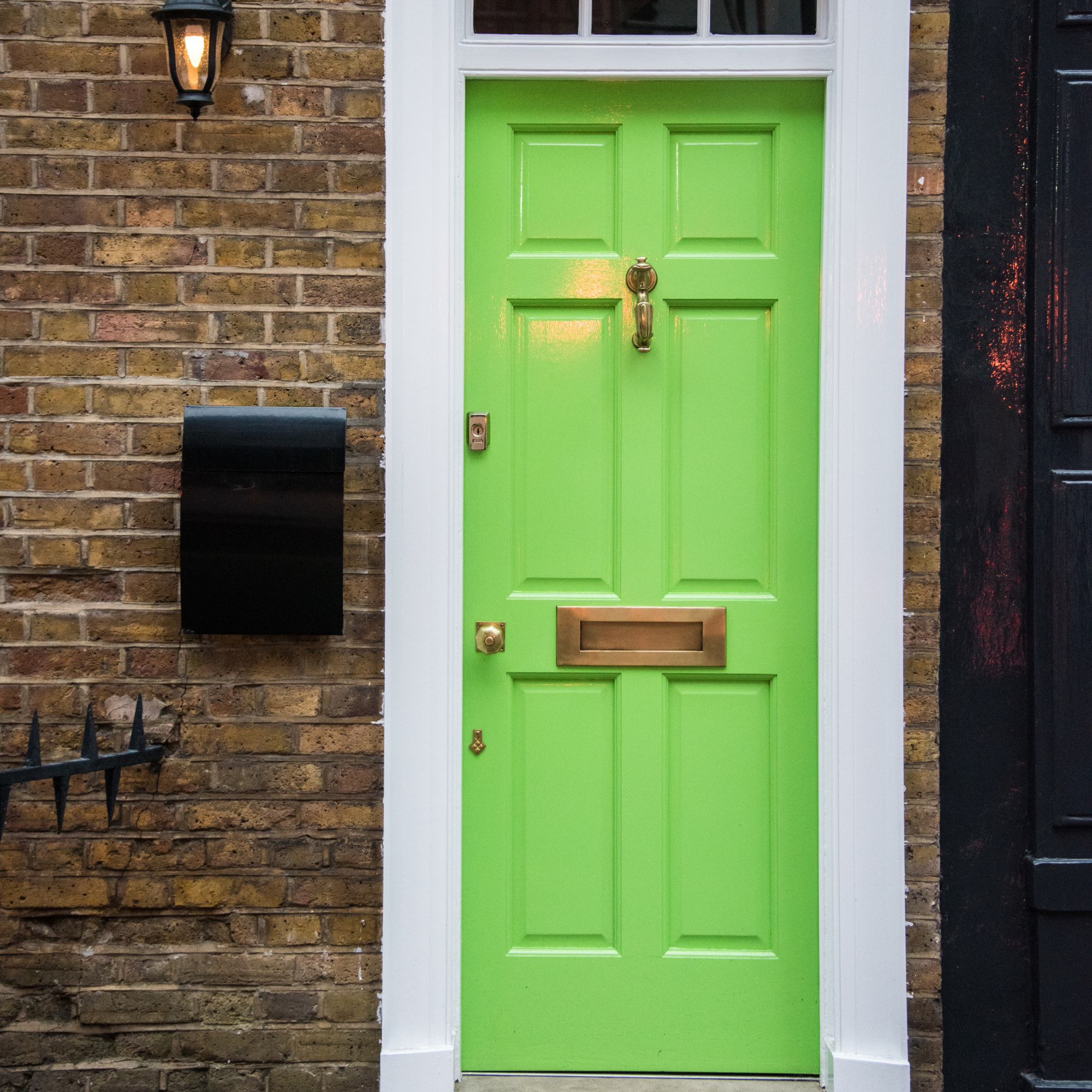 Lime green front door on georgian home.