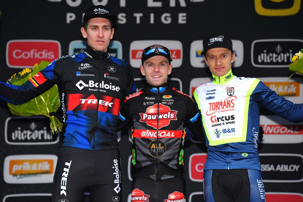 NIEL BELGIUM NOVEMBER 11 LR Toon Aerts of Belgium and Team Baloise Trek Lions on second place race winner Eli Iserbyt of Belgium and Team Pauwels Sauzen Bingoal and Quinten Hermans of Belgium and TormansCircus Cyclo Cross Team on third place pose on the podium ceremony after the 30th Superprestige Niel Jaarmarktcross 2021 Mens Elite SPNiel Superprestige2022 on November 11 2021 in Niel Belgium Photo by Luc ClaessenGetty Images