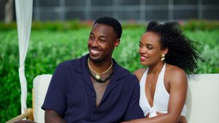 Brion Whitley and Shante Glover smiling in Temptation Island on Netflix