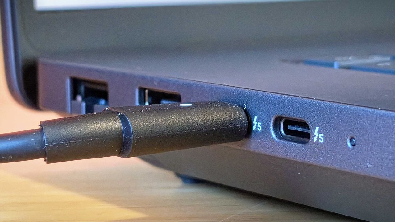 A Dell Pro Max 18 Plus laptop on a wooden desk