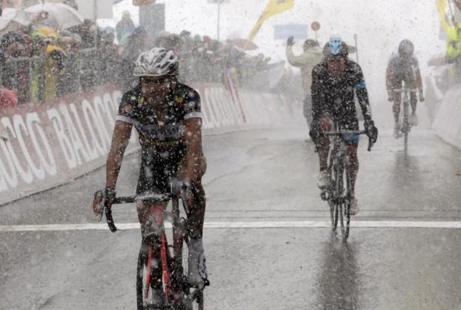 Fabio Duarte (Colombia) finishes second, followed closely by compatriot Rigoberto Uran (Sky) in the snow on Tre Cime di Lavaredo