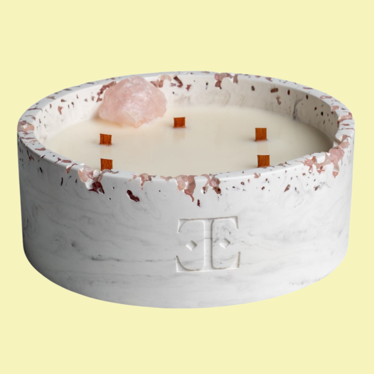 A stone multi wood wick candle with a crystal